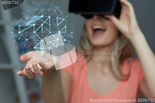 Image of happy woman in virtual reality headset or glasses