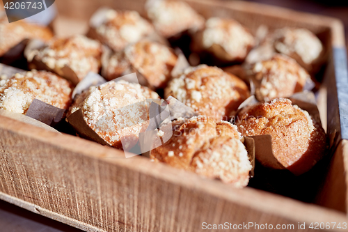 Image of close up of muffins in wooden box