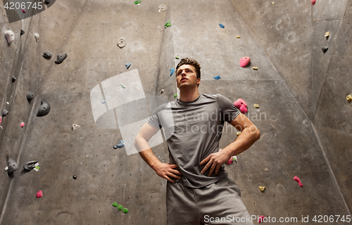 Image of young man exercising at indoor climbing gym