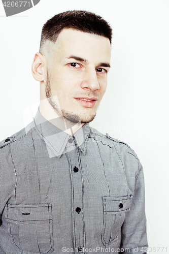 Image of young handsome well-groomed guy posing emotional on white background, lifestyle people concept 