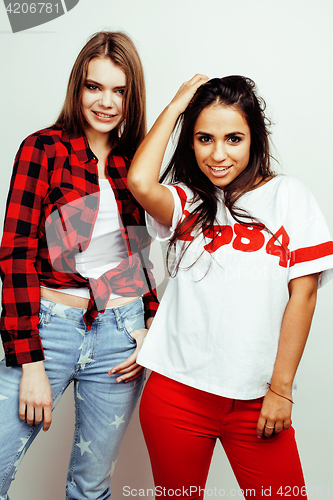 Image of best friends teenage girls together having fun, posing emotional on white background, besties happy smiling, lifestyle people concept, blond and brunette multi nations 