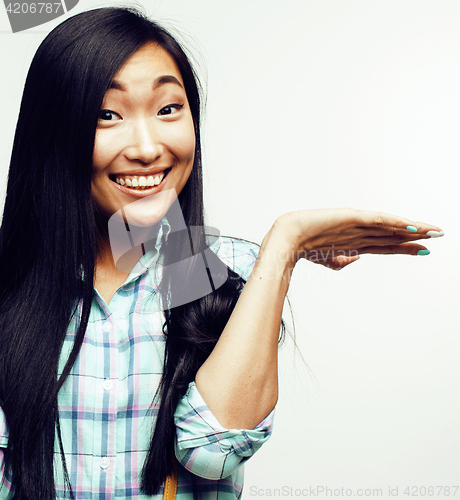 Image of young pretty asian woman posing cheerful emotional isolated on white background, lifestyle people concept