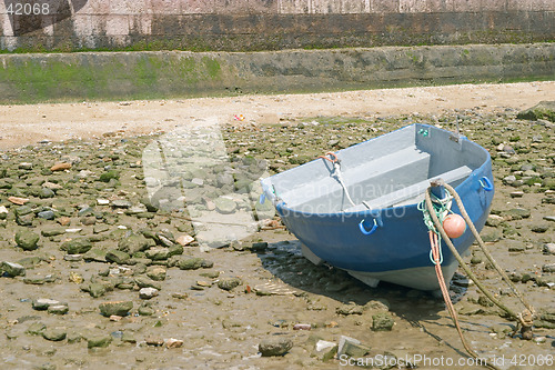 Image of Tied down boat with low tide in the bay of Cadiz, Andalusia, Spain