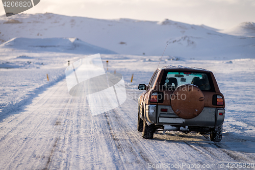 Image of SUV car on the empty road in Iceland