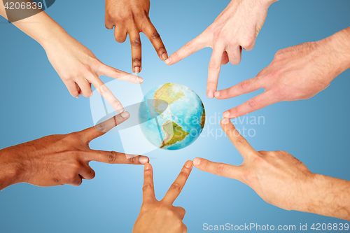 Image of group of international people showing peace sign