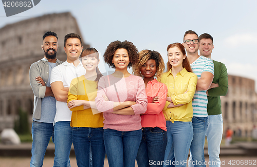 Image of international group of happy people over coliseum