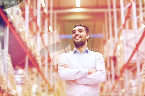 Image of happy man at warehouse