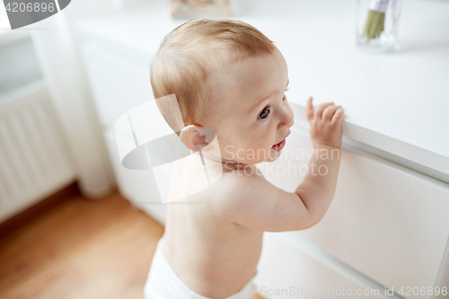 Image of close up of happy little baby boy or girl at home