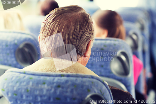 Image of close up of senior man sitting in travel bus