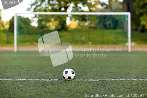 Image of soccer ball and goal on football field