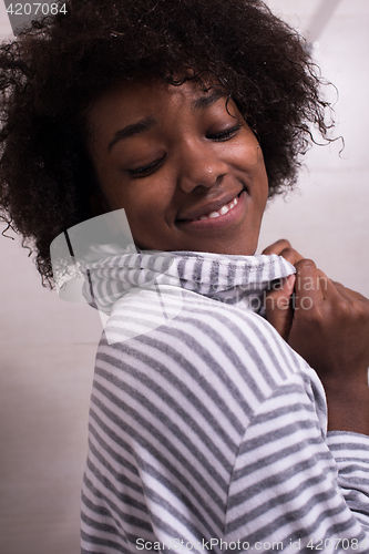 Image of beautiful black woman wearing  bathrobe