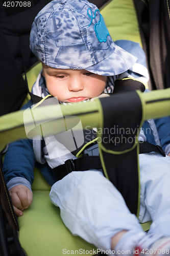 Image of baby boy sitting in the pram