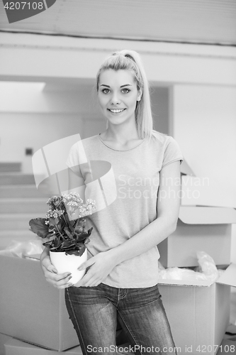 Image of girl moving in the new apartment