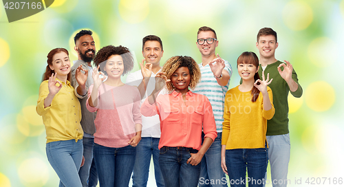 Image of international group of happy people showing ok