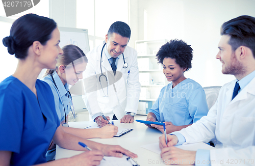 Image of group of happy doctors meeting at hospital office