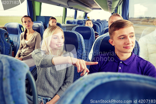 Image of group of tourists in travel bus