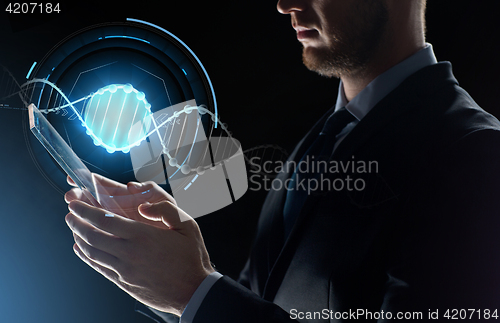 Image of close up of businessman with transparent tablet pc