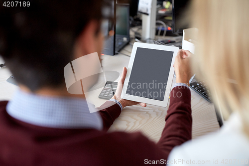 Image of business team with tablet pc at office