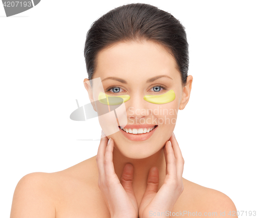 Image of beautiful young woman face with under-eye patches