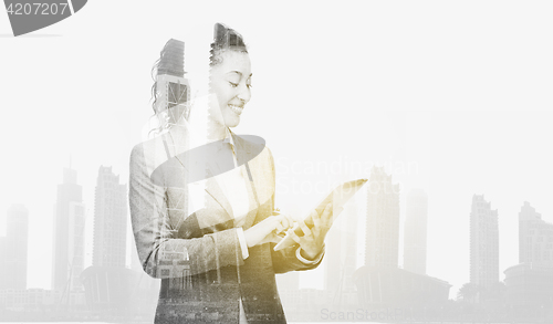 Image of smiling businesswoman with tablet pc computer