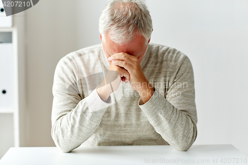 Image of close up of senior man thinking