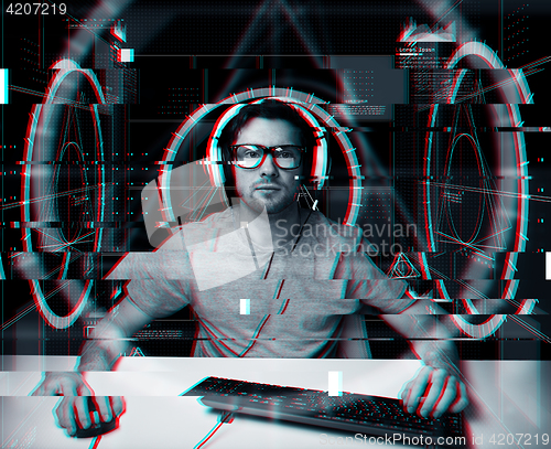 Image of man in headset with computer virtual projections