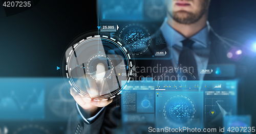 Image of businessman touching virtual screen projection