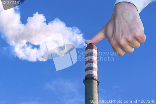 Image of Man with hand making stop to environmental pollution