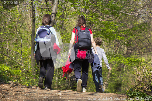Image of Two women and child going for a walk in a forest