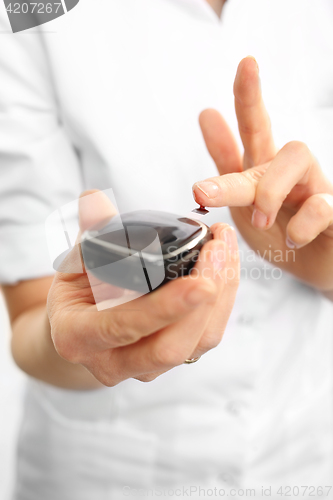 Image of Glucometer. Measuring the level of sugar in the blood 