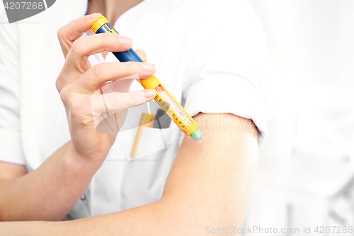 Image of Diabetes, a woman with diabetes A woman injected insulin in the arm