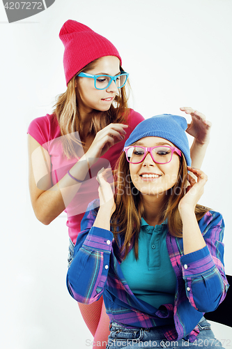 Image of lifestyle people concept: two pretty stylish modern hipster teen girl having fun together, happy smiling making selfie