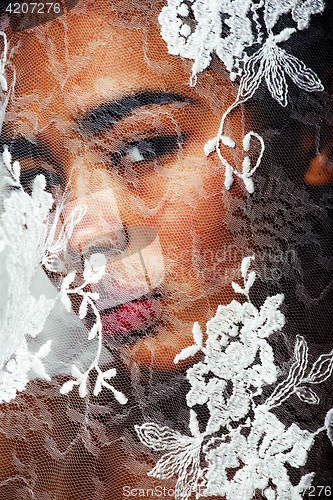 Image of portrait of beauty young afro woman through white lace, like new