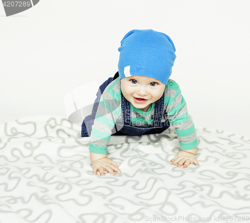 Image of little cute baby toddler on carpet isolated close up smiling ado