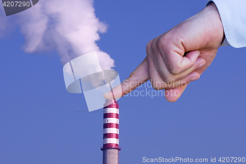 Image of Man with hand making stop to environmental pollution