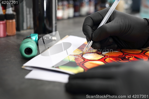 Image of Tattoo design painted on vellum. Stages of creating a tattoo