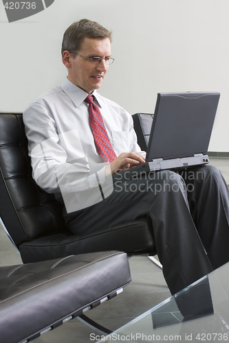 Image of Businessman working with laptop computer