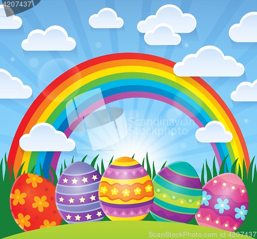 Image of Easter theme with eggs and rainbow