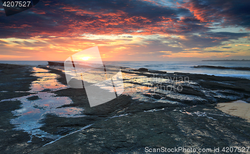 Image of Glorious sunrise Culburra beach rock shelf