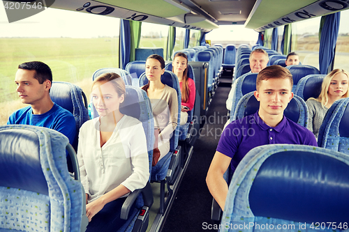 Image of group of passengers or tourists in travel bus