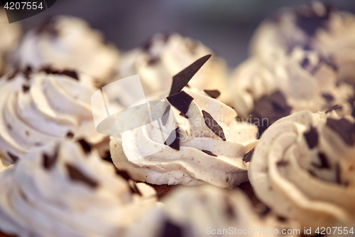 Image of close up of cupcakes or muffins with frosting