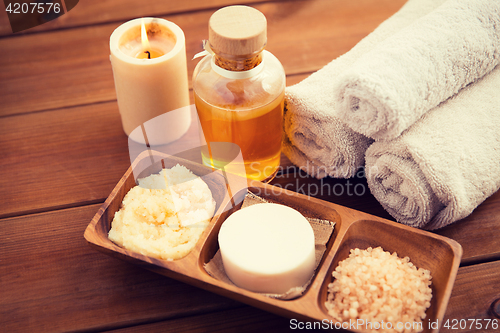 Image of close up of natural cosmetics and bath towels