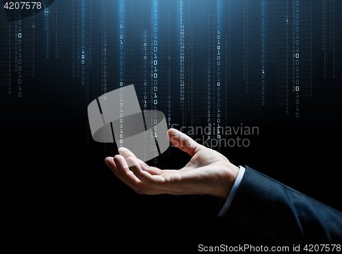 Image of close up of businessman hand with binary code