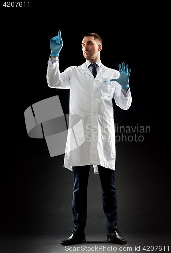 Image of doctor or scientist in lab coat and medical gloves