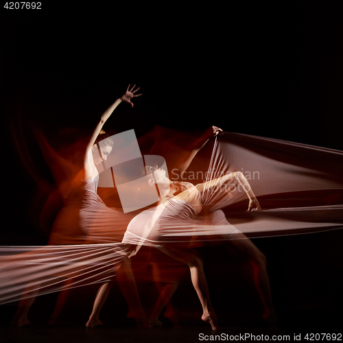 Image of The sensual and emotional dance of beautiful ballerina