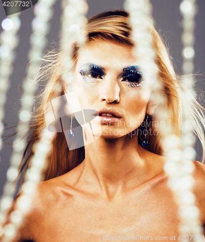 Image of beauty young snow queen in fairy flashes with hair crown on her 