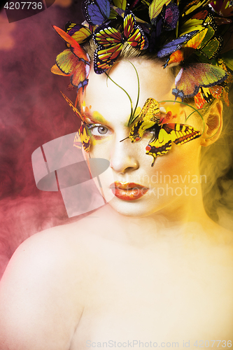 Image of woman with summer creative make up like fairy butterfly closeup 