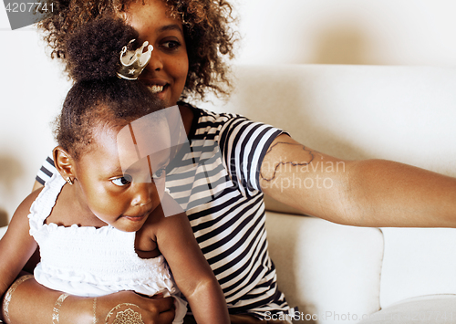 Image of adorable sweet young afro-american mother with cute little daugh