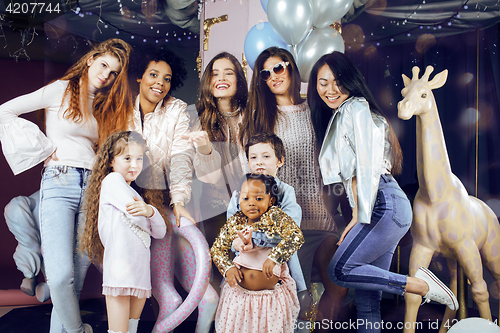 Image of Lifestyle and people concept: young pretty diversity nations woman with different age children celebrating on birth day party together happy smiling, making selfie. African-american, asian and caucasi