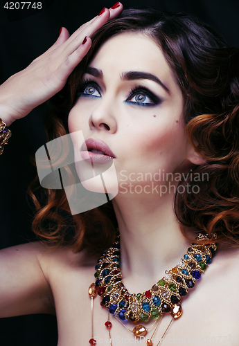 Image of beauty rich woman with luxury jewellery looks like mature